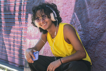 urban man with headphones dancing on the street