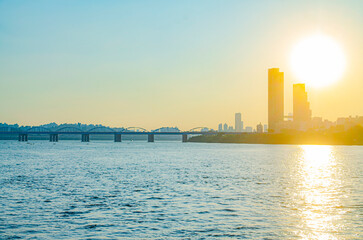 Beautiful Colorful Sunset  in river. at business District in City.