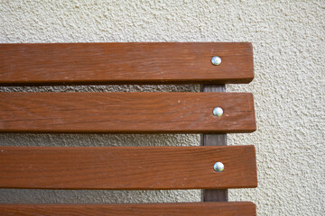 Garden bench on the background of the wall