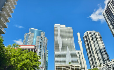 Obraz premium Miami, Florida, USA - June 26, 2024: Looking at up highrise condo towers at Park West District.