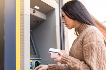 Young woman using an ATM