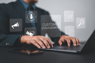 Customer engagement concept. Target customer, buyer persona and customer behavior. Businessman using laptop with customer engagement icon on virtual screen.