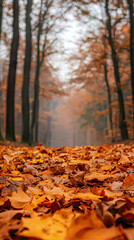 A carpet of golden leaves, a path through a misty autumn forest. Nature's artistry unfolds with each falling leaf.