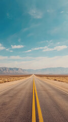 Fototapeta premium Endless Road: A lone highway stretches towards the horizon, promising adventure in the heart of the desert.
