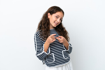Obraz premium Little caucasian girl isolated on white background surprised and pointing front