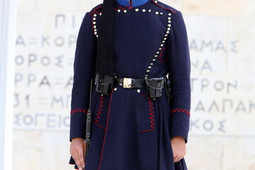 Guards march at the entrance to the royal palace.