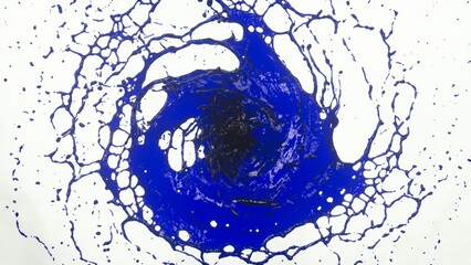 A dynamic image of blue liquid forming a splash vortex against a white background, showcasing vibrant color and fluid motion.