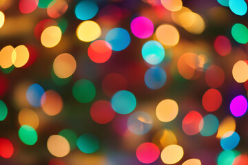 A close-up of glowing multicolored Christmas lights in a blurred bokeh pattern, creating a festive atmosphere
