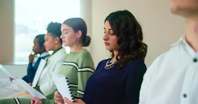 Waiting room, business people or candidates with documents for interview, work opportunity and hiring. Row, job seeker and patience with resume for creative agency, recruitment and employment process