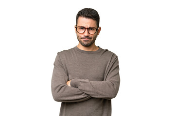 Young handsome caucasian man over isolated background with unhappy expression