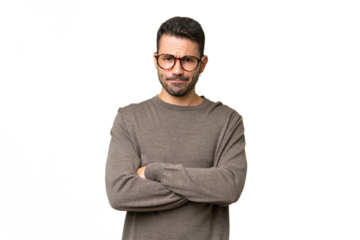 Young handsome caucasian man over isolated background with unhappy expression