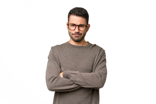 Young handsome caucasian man over isolated background with unhappy expression