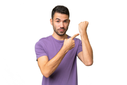 Young handsome caucasian man over isolated background making the gesture of being late