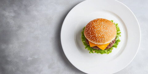 Cheeseburger on white ceramic plate, positioned in the middle