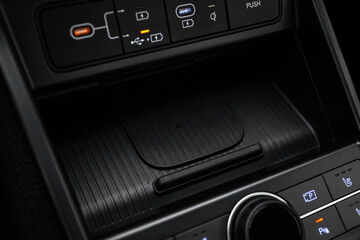 Obraz premium Close-up of wireless charging inside a car