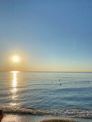 It is impossible to tear your eyes away from the natural beauty of the sunny path that emerges from behind the horizon and stretches across the boundless water surface to the sea coast.