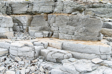 background of a stone wall from old stones, stones of the correct form. old wall texture. Estonia, Saaremaa