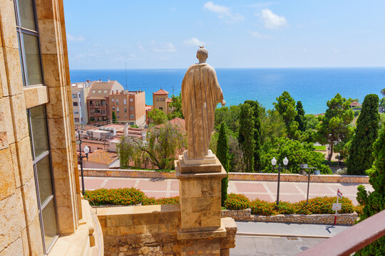 Tarragona, Spain - July 14, 2024: Statue of Emperor Caesar Augustus Overlooking Beautiful Tarragona Coastline and City
