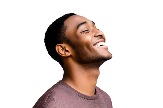 Close up profile happy young African American man laughing against gray background