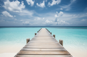 Fototapeta premium Scenic Wooden Pier Leading to Turquoise Ocean, Tropical Paradise with Clear Blue Sky