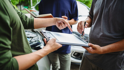 Three Asian men discussing car insurance policies with adjuster. They review details such as premiums, deductibles, coverage options while handling recent claim and evaluating the settlement process.