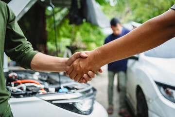 Three Asian men discussing car insurance policies with adjuster. They review details such as premiums, deductibles, coverage options while handling recent claim and evaluating the settlement process.