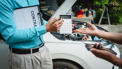 Car seller agent signs a car insurance agreement with salesman. The document outlines vehicle...