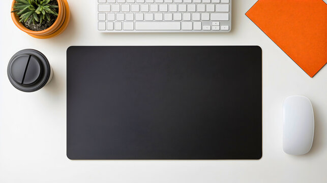 Modern workspace with a desk, keyboard, and mouse on mat, clean and minimal office setup with a cup of coffee and a succulent plant, professional and organized work environment