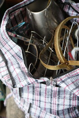 A close-up of a toolkit bag with various metal objects 