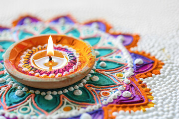 Traditional oil lamp with rangoli design
