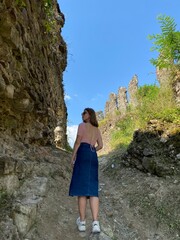 Naklejka premium young girl on an old ruins
