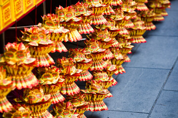 a collection of paper lotus flowers used for rituals