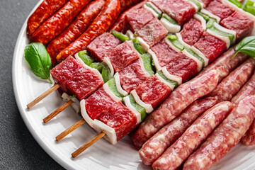 sausage meat assorted juicy pork, beef fresh delicious gourmet food background on the table rustick food top view copy space