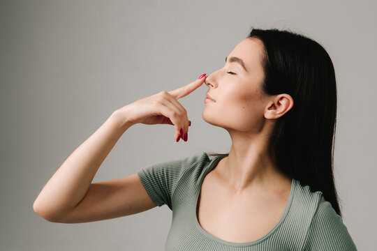 Septoplasty. Young girl is suffering from deviated nasal septum. Healing breathing issues with rhinoplasty. Abuse of vasoconstrictor nasal drops is leading to addiction.