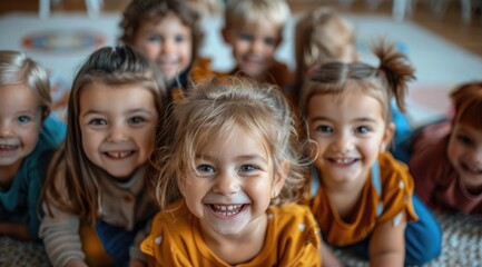 Fototapeta premium Happy preschool children lying on mat
