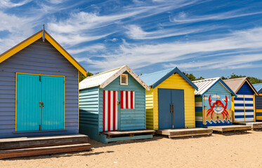 Naklejka premium Beautiful bathing houses on white sandy beach at Brighton in Melbourne, Australia.