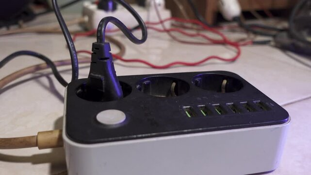 Overloaded socket and USB multi-port. Modern convenient USB multi-port charger for devices