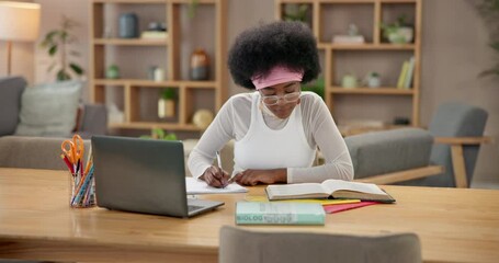 Black woman, writing notes and student reading book in home for study or online education on laptop. University, exam and girl elearning on computer for research, science or biology test preparation