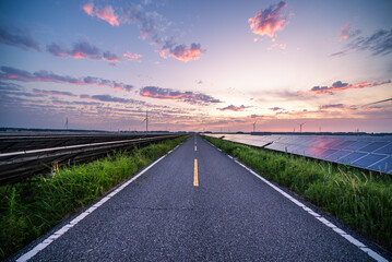 empty road through solar power station at sunset © zhu difeng
