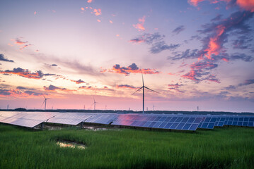 solar power station and wind power turbine at sunset © zhu difeng