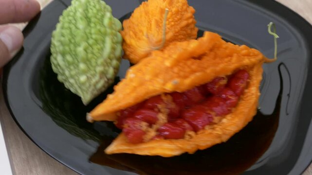 ripe and yellow Momordica charantia (Mother melon) fruit for stomach upset,