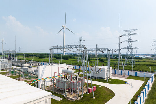 view of converting substatioin and wind power turbine in field