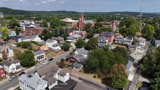 A wide forward aerial establishing shot above a residential neighborhood in Lancaster, Ohio, the county seat of Fairfield County.  	
