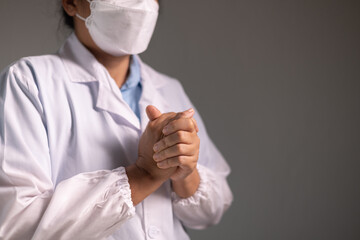 Doctor prays for the health of the person under their care, as medicine, nurses, and health care at the hospital work together to fight the disease. doctor, pray, health, person, medicine, care.