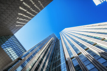Modern Skyscrapers Towering Over Urban Skyline © evening_tao