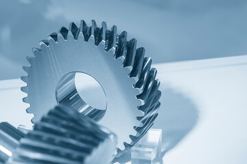 Close up the transmission  gear spare parts in the light blue scene.