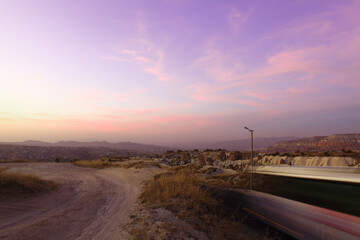 Twilight Over Fairy Chimneys in G&ouml;reme Valley, Cappadocia: Scenic Sunset and Rugged Landscape