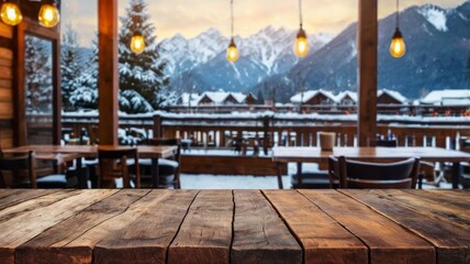 Empty wooden tabletop with blurred restaurant on winter mountain background