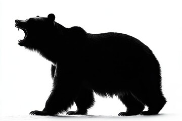 Obraz premium A silhouette of a roaring bear against a bright background.
