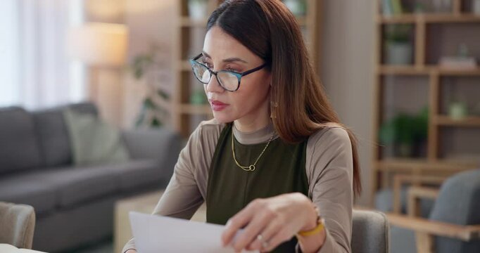 Businesswoman, paperwork and laptop with typing in home for creative brand proposal and digital marketing strategy. Remote work, entrepreneur and review for online website launch and project feedback